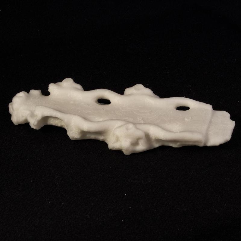 Table decorated with serpents and deities bearing vessels spouting streams of water