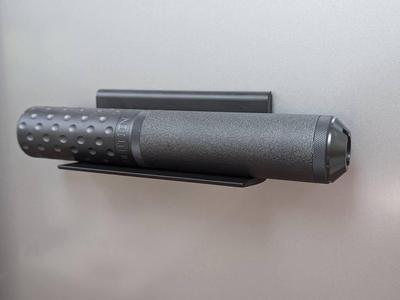 Magnetic shelf for rifle sound moderator