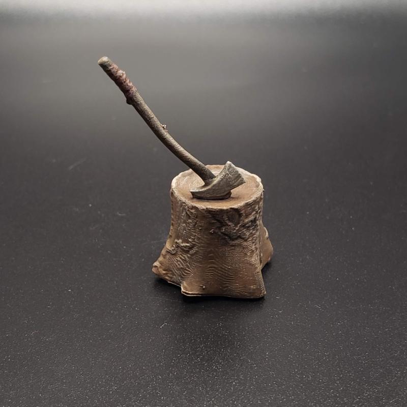 Tree stump with axe