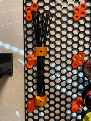 Honeycomb wall zip tie holder
