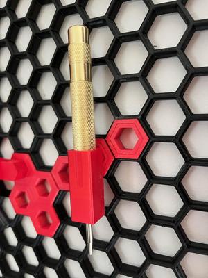 Honeycomb hook punch holder