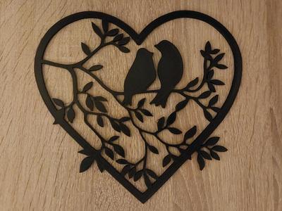 Pair of birds in a heart on branches / Vogelpaar in einem Herz auf Ästen