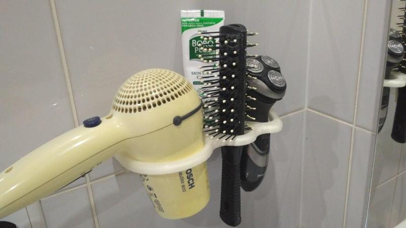 Bathroom hairdryer and shaver holder