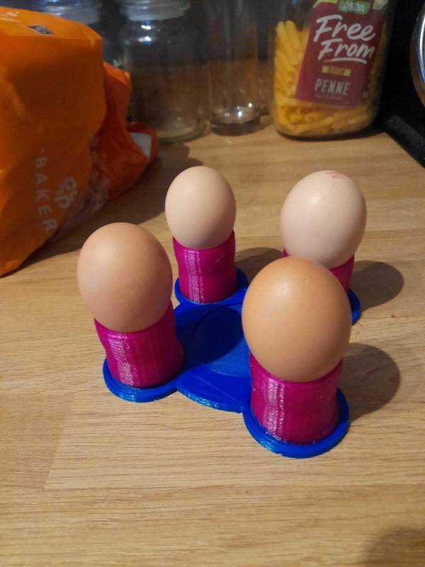 Egg cup holder with plate.