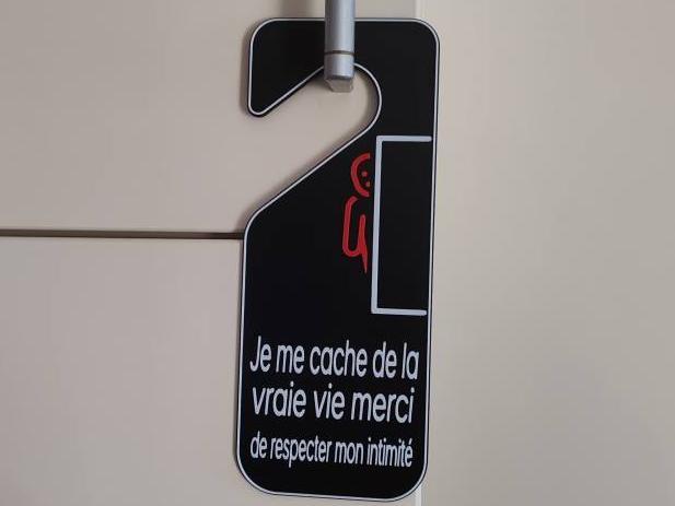 Humorous 'Do Not Disturb' Door Hanger