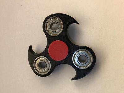 Tri spinner with fins