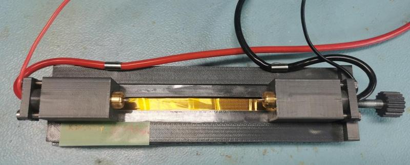 A holder for testing 18650 cells (other sizes also up to 21700).