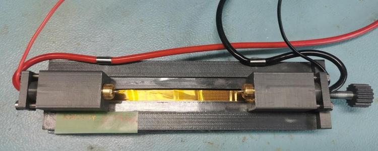 A holder for testing 18650 cells (other sizes also up to 21700).