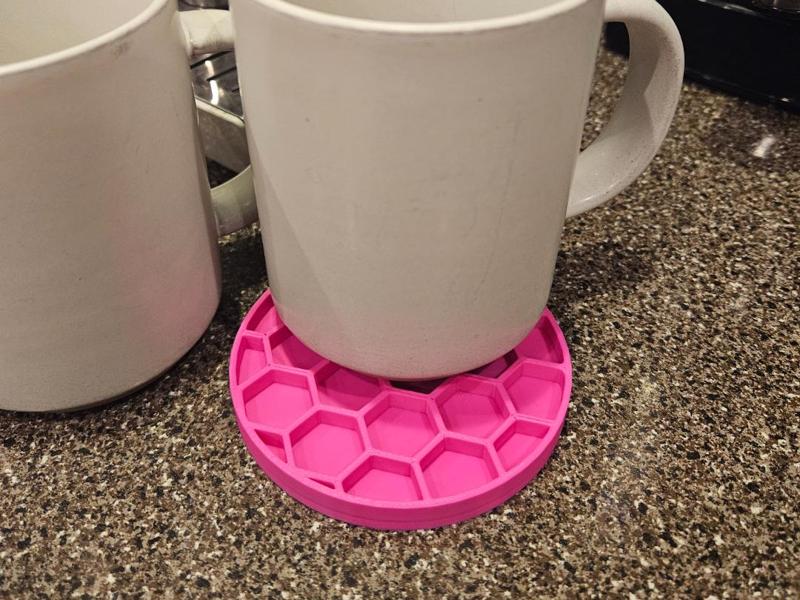Hexagon drink coaster with spill catcher honeycomb