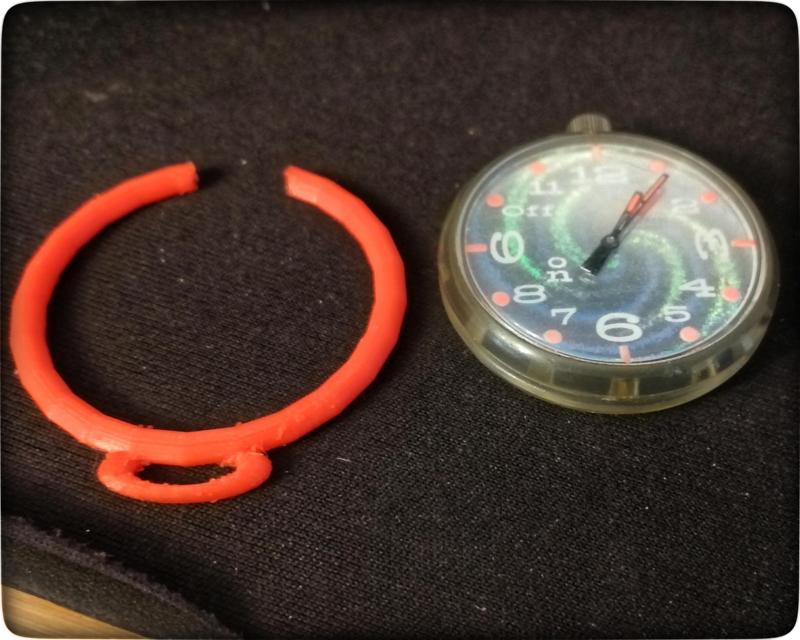 Swatch pocket watch, holding ring