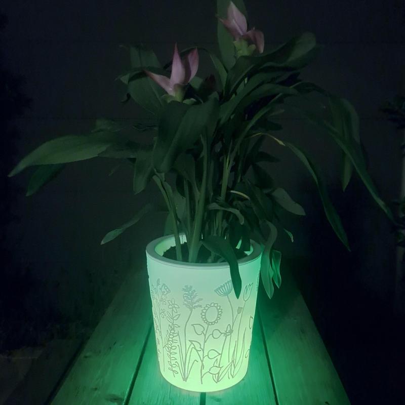 Illuminated flower pot with hand painted relief