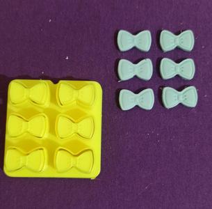 Miniature bow tie cutter.