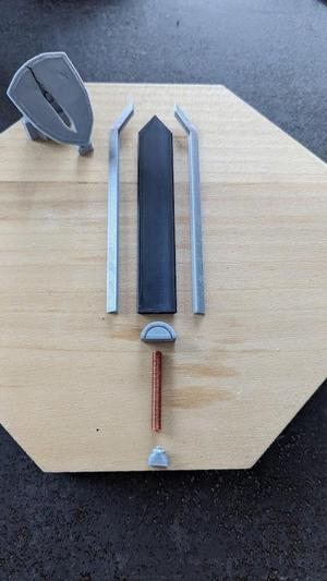 Figure of Guts' sword stuck in a shield, Manga Berserk