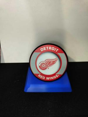 Field hockey puck base