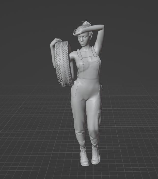 Sexy Mechanic Woman Holding Tire