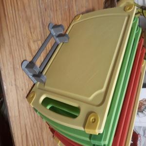 Holder for kitchen boards or the like