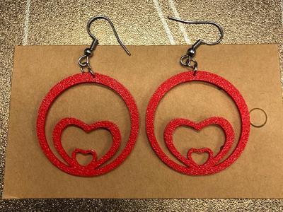 Two hearts in circle earrings