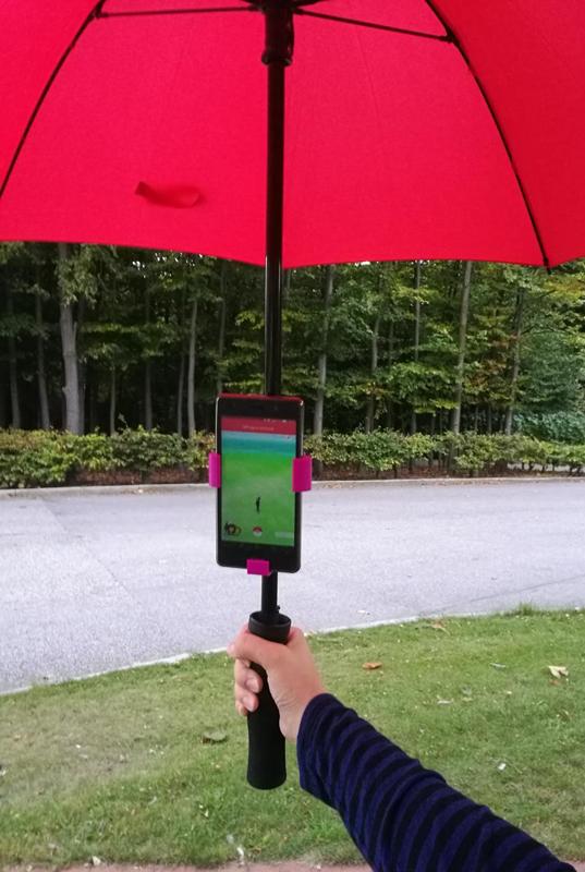 Universal phone holder for an umbrella
