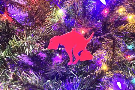 Dog pooping ornament