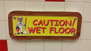 chuck e cheese caution wet floor sign