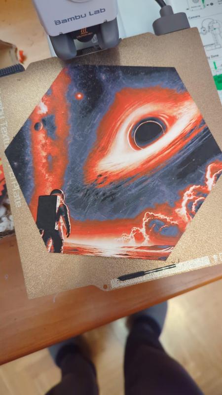 Hueforge hex - Astronaut looking at a black hole