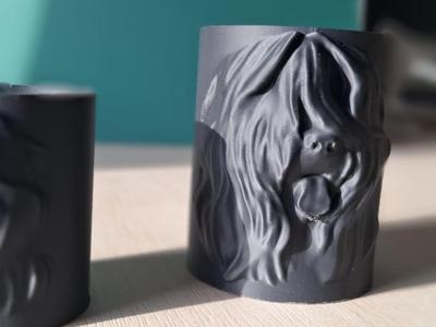 A mug with a Briard dog, for holding pens