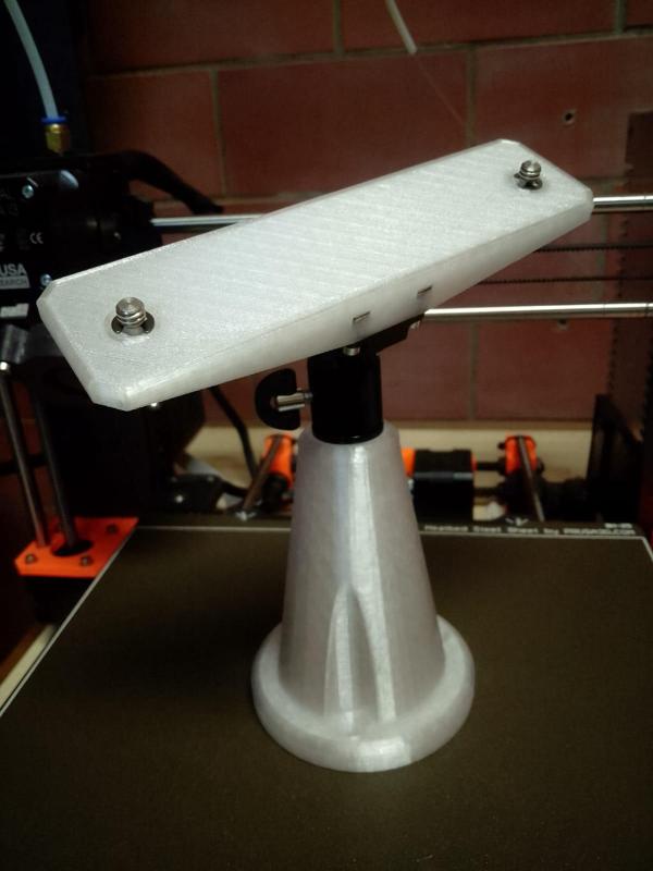 Double mounting of the camera on the photographic head