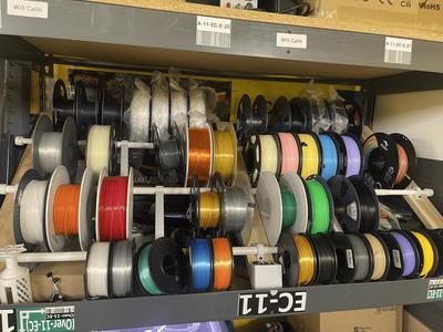 Angled filament rack mounting clips and spacer