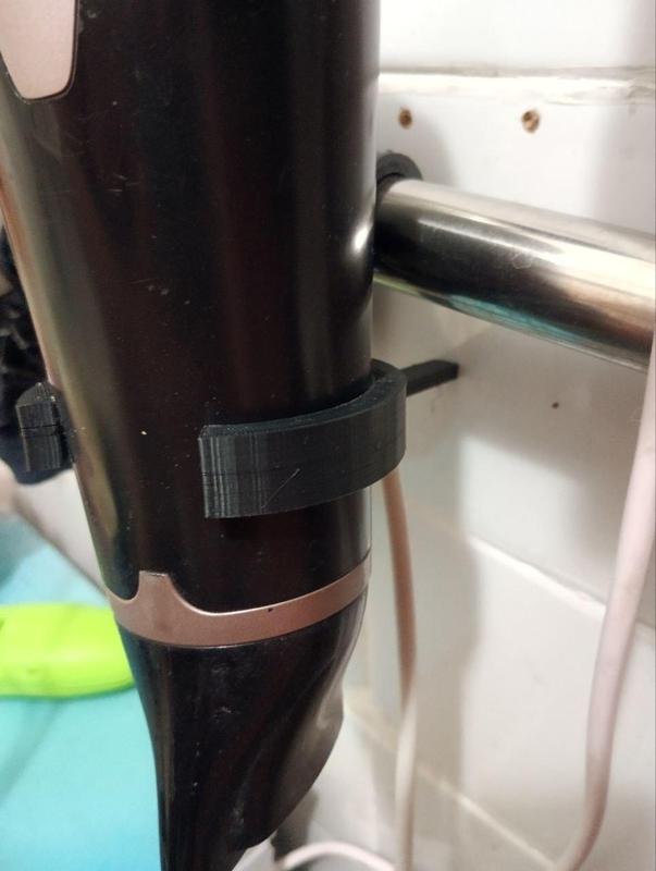 Hair dryer holder on the coil