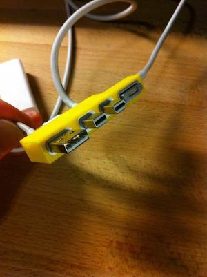 Cable tidy for 15 inch Retina Macbook Pro in OpenSCAD