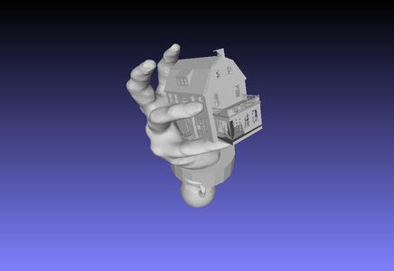 hand holding Amityvile house