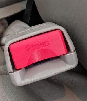 Mazda seatbelt release button