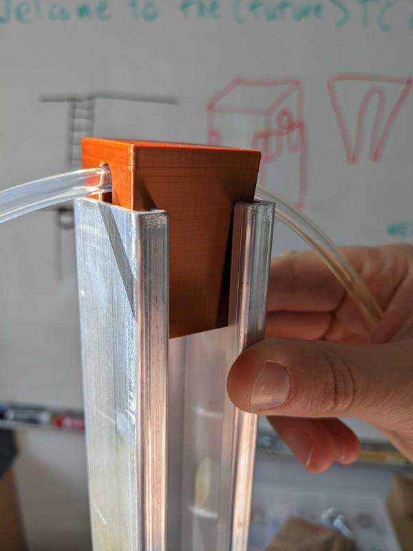 Parametric tubing holder for strut channel