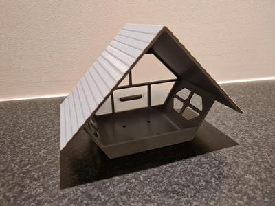 Cozy looking bird feeder with (semi-) transparent back
