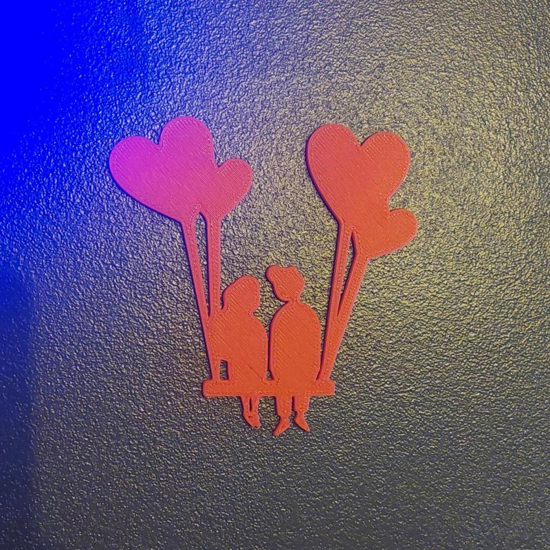 2 lovers on a heart swing