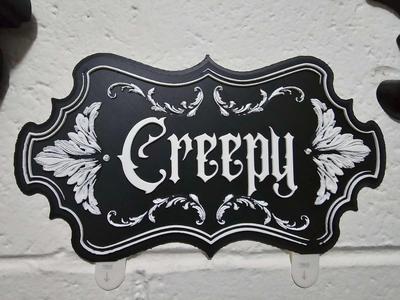 Creepy wall decor sign