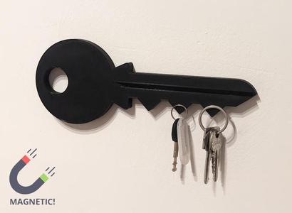 Key-shaped magnetic key holder