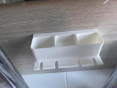 Toothbrush wall holder
