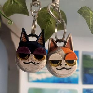 cursed animal crossing cats keychain