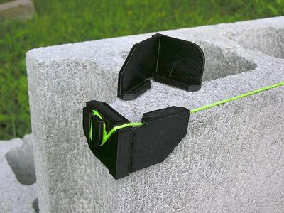 Builder's block line corner anchor bracket