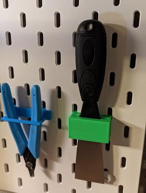 Scraper holder for IKEA Skadis