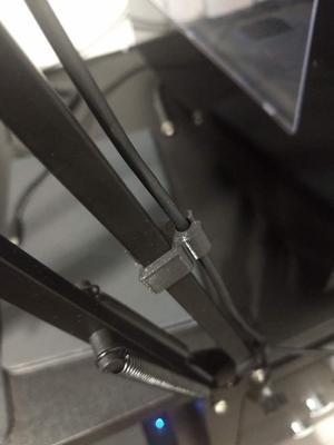 Boom arm wire clip