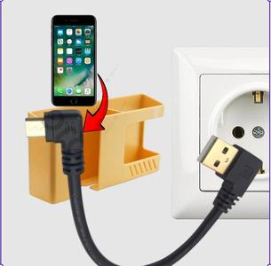 phone holder and multi-purpose device next to the socket