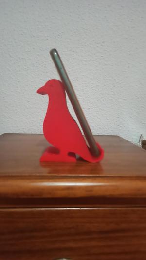 Cell phone holder in the shape of a bird