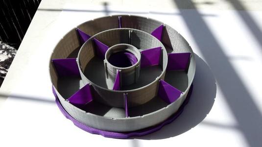 Round donut organizer for small parts, resizable sections.