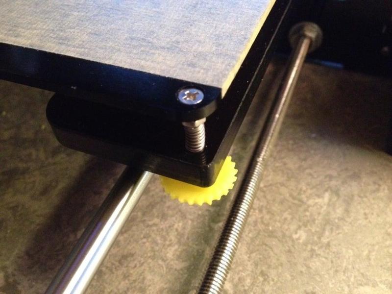 Bed leveling thumb screw with embedded nut.