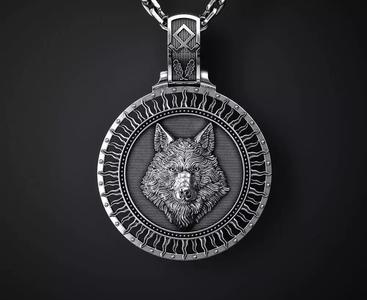 A PENDANT WITH A WOLF S HEAD AND A TREE OF LIFE