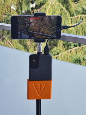 Versatile Snap-On Holder for Power Banks, Remote Controls and others.