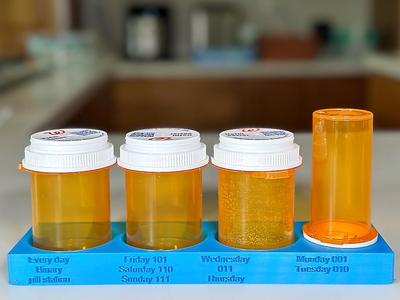 A Pill bottle stand for Three large and One medium  Walgreens bottles