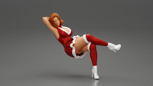 Santa Female sitting in vintage chair